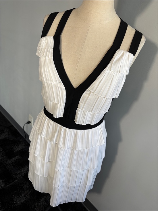 BCBGMaxAzria Dresses & Skirts - BCBGMaxAzria White Pleated Tiered Mini Dress with Black Trim